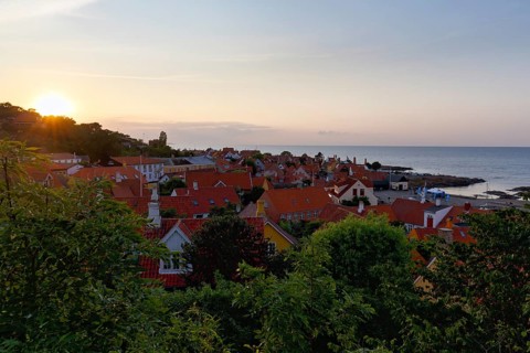 View of Gudhjem, view over the roofs of the Baltic Sea, sunset, sunbeams, Gudhjem, Bornholm, Baltic