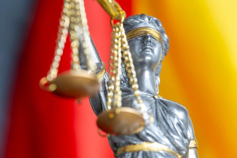 Close-up of justice in front of the flag of Germany (symbolic image)