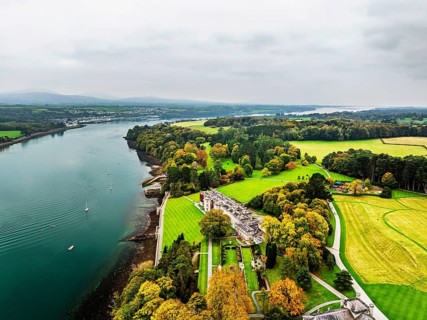 Autumn over Plas Newydd House from a drone, Gardens and Parkland, Llanfairpwllgwyngyll, Anglesey,