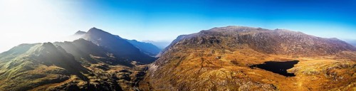 Autumn colours of Pen-y-Pass over Miner's Track, Start Point and road A4086 from a drone,
