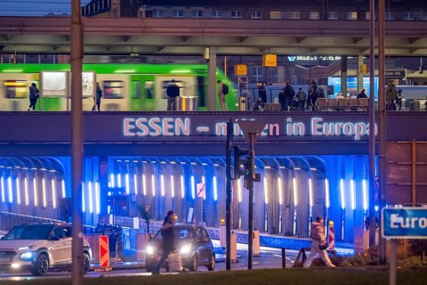 The main train station in Essen, blue-lit underpass, bus station, am Europaplatz, public transport