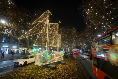The Kurfürstendamm in western Berlin with Christmas lights and several light installations, such as