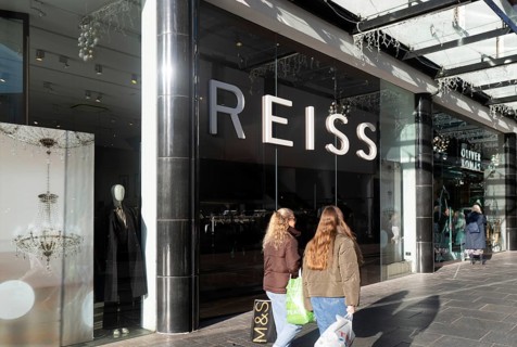 Shoppers walking past Reiss shop store in city centre, Princesshay, Exeter, Devon, England, UK