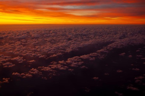 View from airplane window at sunrise