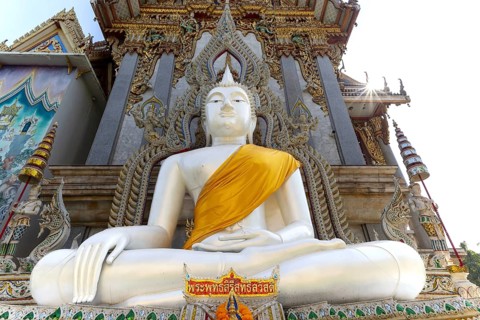 Buddha statue with tunic, Bhumispara mudra, Buddha Gautama at the moment of enlightenment, at the