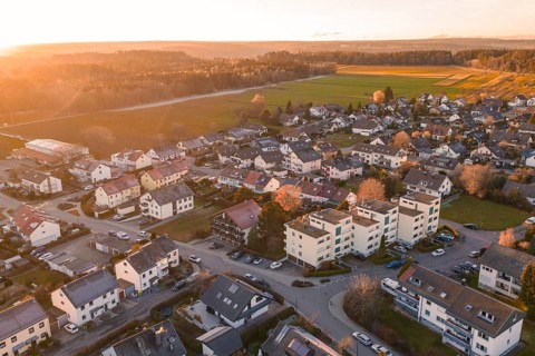 Aerial village with settlements and fields in evening autumn light, Althengstett, Calw district,