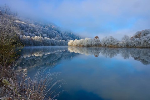 Clear water reflects the snow-white trees and the quiet winter panorama, hoarfrost, winter, Boxtal,