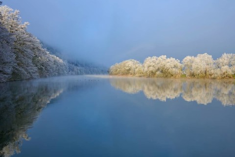 Cool winter atmosphere with snow-white tree reflections in still water, hoarfrost, winter, Boxtal,