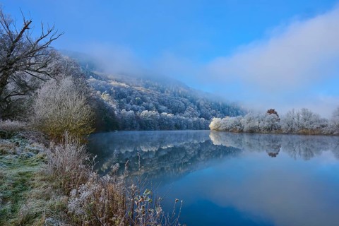 Winter river with frozen bank and fog over trees, clear atmosphere, hoarfrost, winter, Boxtal,