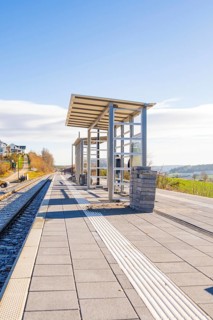 Spacious railway platform with modern architecture and far-reaching views, new Hermann Hessebahn