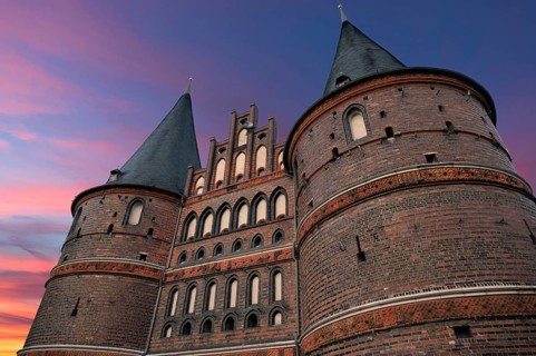 Holstentor, historic city gate from 1478, evening sky, Holstentorplatz, Hanseatic City of Lübeck,