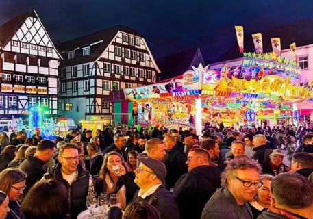 Many people at the All Saints Fair in the evening in front of half-timbered houses, Old Town,