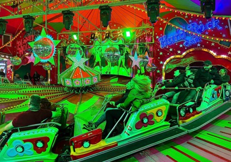 People on the Musik-Express ride at the All Saints Fair, the biggest old town fair in Europe,