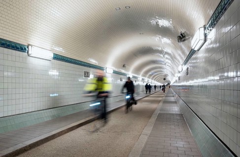 Interior view, pedestrians and cyclists crossing tunnel, mopping effect, movement, tube, historic