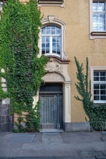 Stucco decoration above the entrance to Johanneum, built in 1905, near St. Johannis 1-3, Hanseatic