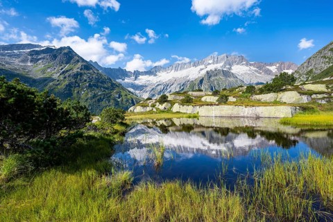 Picturesque mountain landscape, dammastock and damma glaciers reflected in Moorsee, Göscheneralp,