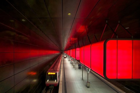 HafenCity University subway station, illuminated in color, red, underground train, movement effect,
