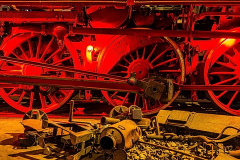 Illuminated wheelwork of a historic locomotive, railway museum, Augsburg railway park,