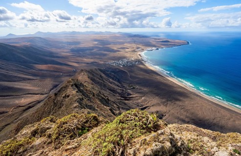 Castillejo viewpoint, view from the Risco de Famara cliffs to the coast and the sea with Famara