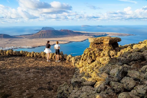 Tourists on the viewing platform at the Mirador del Río viewpoint, in the evening light, view of