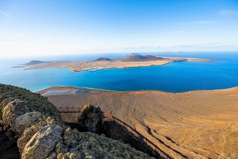 View of La Graciosa island with volcanic craters in the evening light, Mirador del Río viewpoint