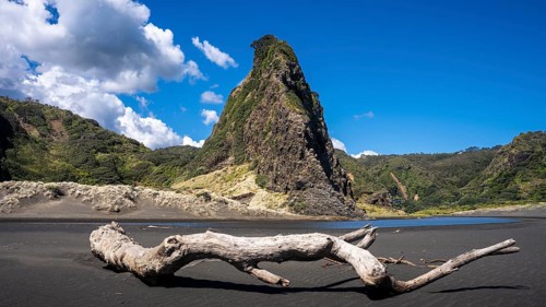 Landscape in New Zealand with sandy beach. Karekare Beach and The Watchman Rock. Karekare,