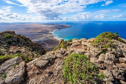 Castillejo viewpoint, view from the Risco de Famara cliffs to the coast and the sea with the Famara