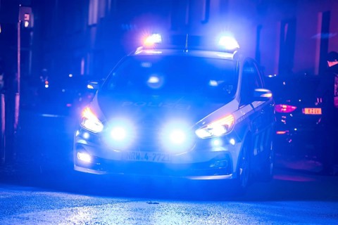 Police patrol car deployed with flashing lights, Essen, North Rhine-Westphalia, Germany