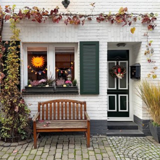 Decorated house façade for the traditional Martin procession in Tiefstraße, Altstadt, Kempen, Lower