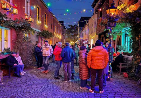 People in the Tiefstraße decorated for the Martin train in the evening, historic old town, Kempen,