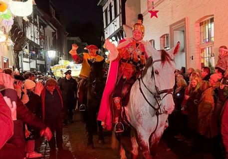 St. Martin on a white horse train in Alte Schulstraße in the evening, Altstadt, Kempen, Lower