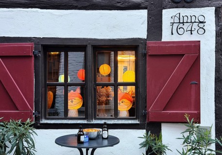 Half-timbered house in the Tiefstraße decorated for the Martin train, Altstadt, Kempen, Lower