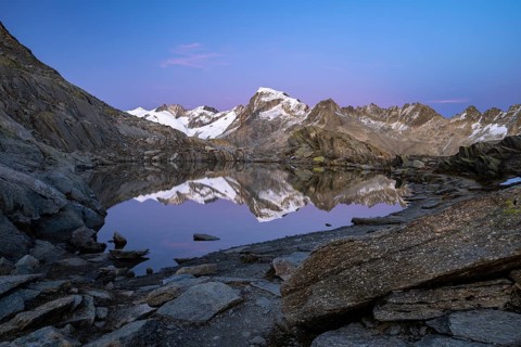 Mount Galenstock is reflected in Bergsee, Grätlisee, Canton of Valais, Switzerland