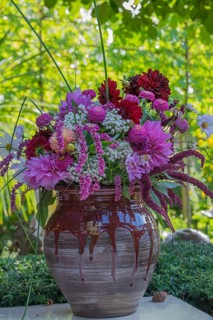 A colorful bouquet of flowers in a decorative vase in the garden, North Rhine-Westphalia, Germany