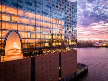Aerial view of the Elbe Philharmonic Hall with reflections on the façade in the evening light above
