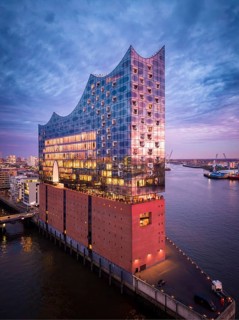 Aerial view of the Elbe Philharmonic Hall with reflections on the façade in evening light above the