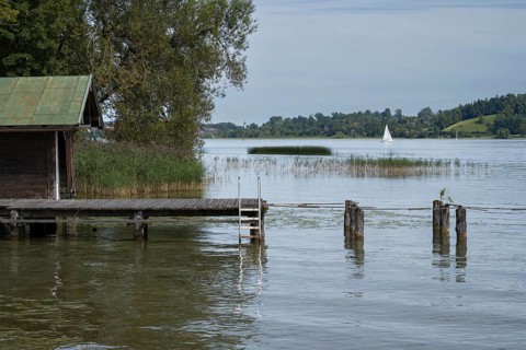Hut and jetty on the banks of Tegernsee, Bad Wiessee, Upper Bavaria, Bavaria, Germany