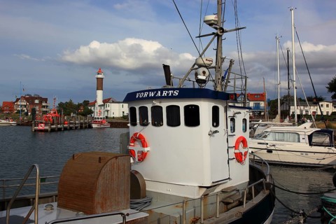 Timmendorf lighthouse on the island of Poel on the Baltic Sea, harbour in the foreground,