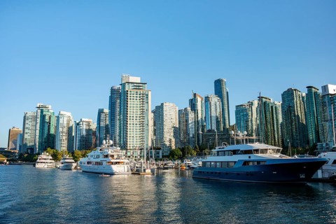 Sailing boats in marina, skyscrapers on the promenade, Coal Harbour, Vancouver, British Columbia,