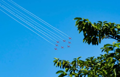 The Indian Air Force (IAF) Surya Kiran aerobatics team performs during an air show as part of the