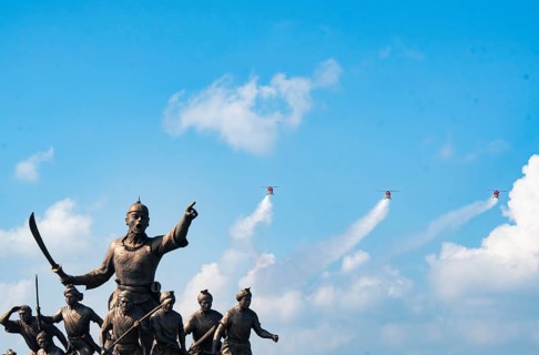 Indian Air Force aerobatic team performs during rehearsals ahead of the air show organised as part