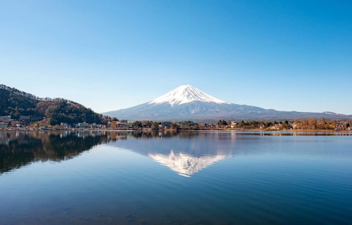 Volcano Mt. Fuji is reflected in Lake Kawaguchi, Yamanashi Prefecture, Japan