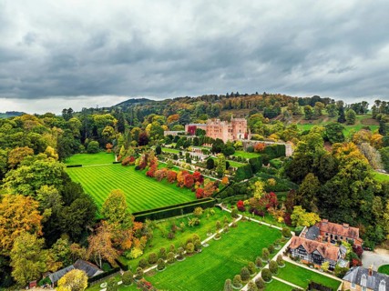 Autumn colours over Powis Castle and Garden from drone, Welshpool, Powys, Wales, England, United