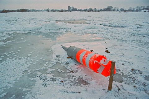 Buoy lying on ice rink, frozen Elbe, Bleckede, Lower Saxony, Germany, January 03, 1997, vintage,