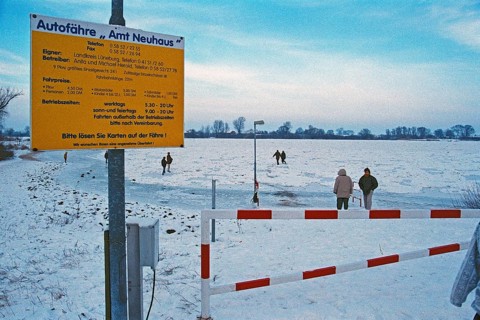 People walk across ice rink, ferry dock, frozen Elbe, Bleckede, Lower Saxony, Germany, January 03,