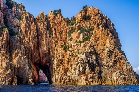 Rock formations and deep blue water in Scandola Nature Reserve, Corsica