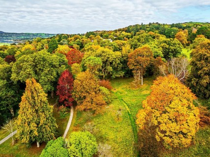 Autumn colours over Bodnant House and Garden from a drone, Conwy River, Colwyn Bay, Conwy, Wales,