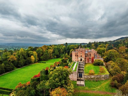 Autumn colours over Powis Castle and Garden from drone, Welshpool, Powys, Wales, England, United