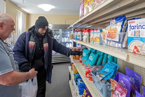 Detroit, Michigan USA - 4 November 2025 - People pick up groceries at the nonprofit Deo Gratias