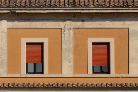 Windows of a building in the city of Rome, Italy